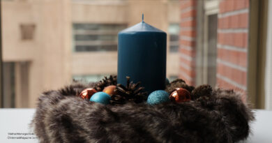 blue candle in fur wreath