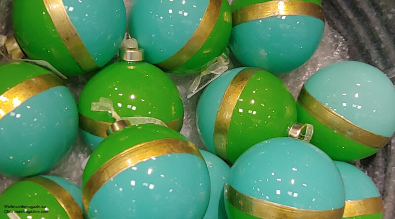 turquoise, green, and gold coloured Christmas baubles